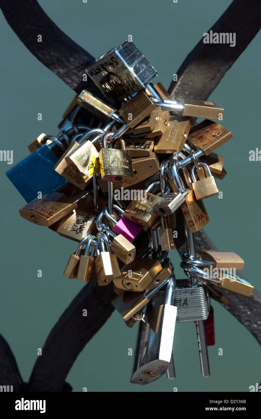 numerous padlocks attached to the balustrade of Bridge of Sant Angelo, Rome, Italy. Stock Photo