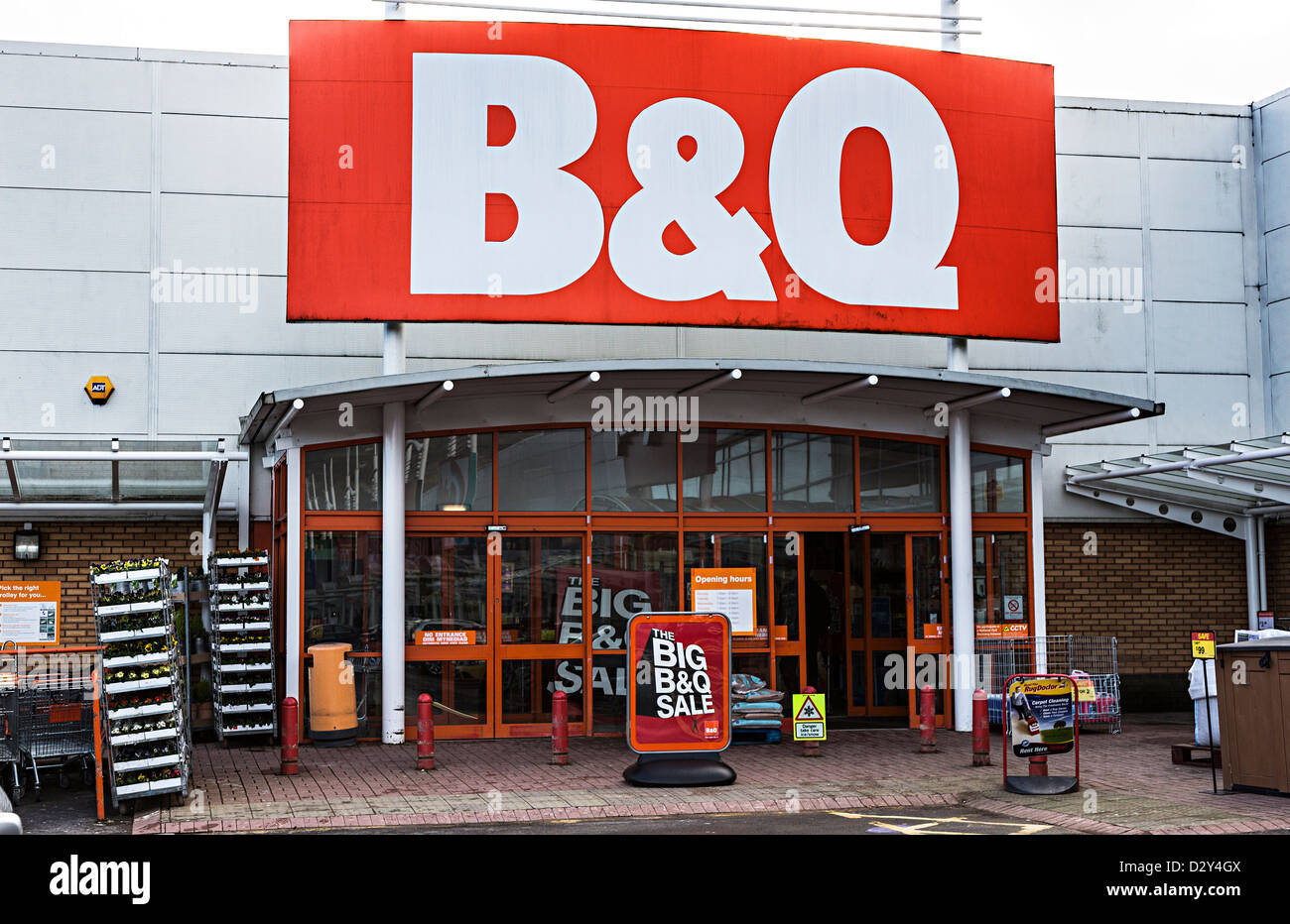 B&Q shop entrance sign with sale, Cwmbran, Wales, UK Stock Photo