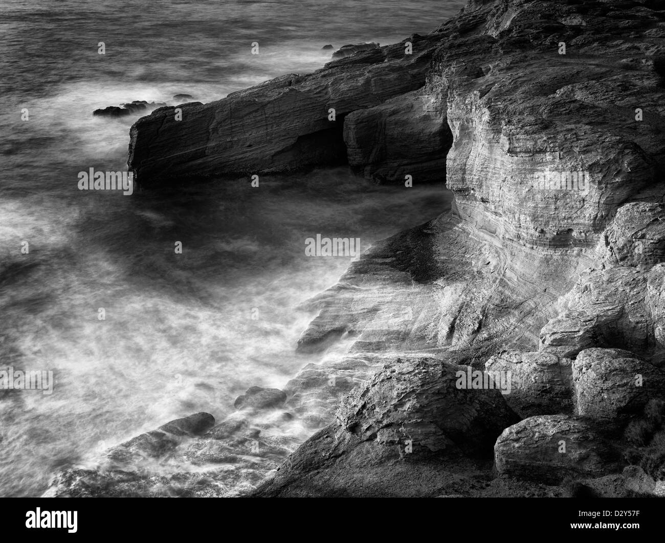 Rock formations and waves at Devil's Punchbowl, Oregon Stock Photo