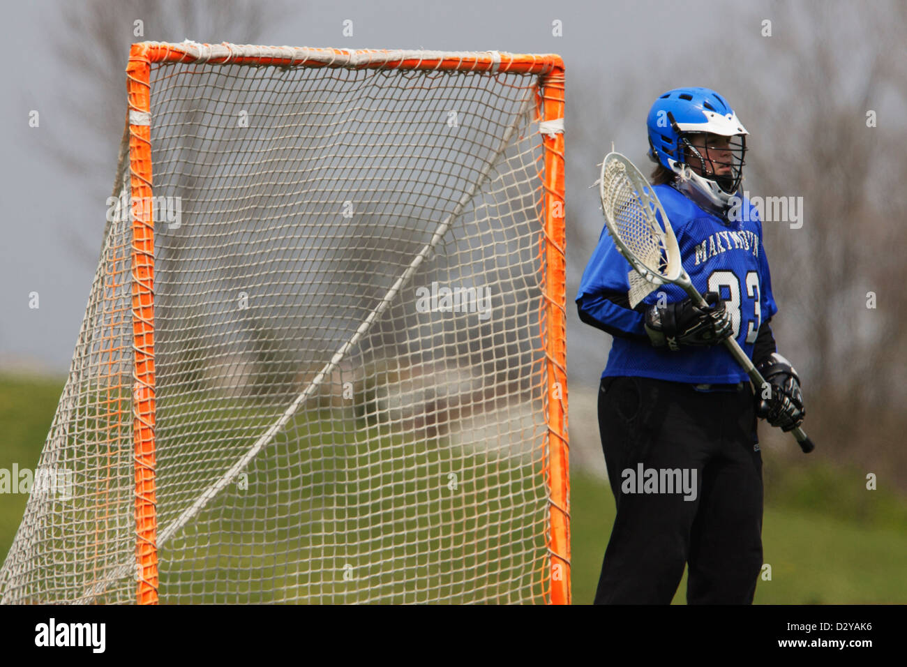 The Marymount University goalkeeper protects the goal during a lacrosse