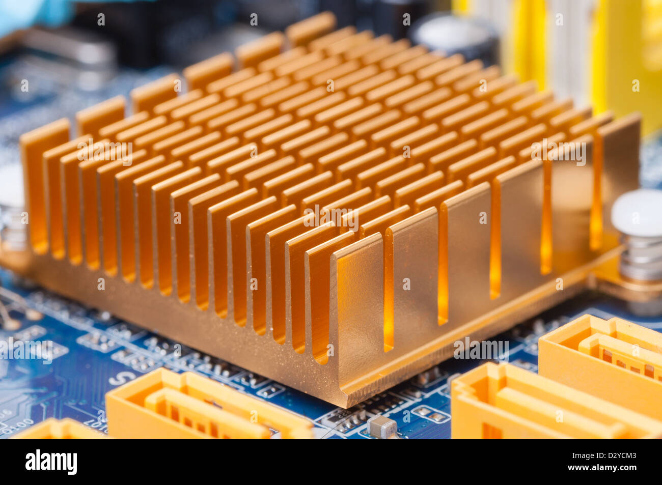 Copper heat sink on computer motherboard abstract background Stock Photo
