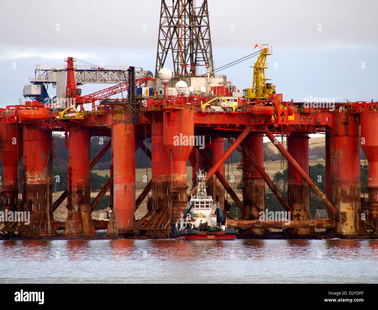 The Semi-Sub Oil Rig 'Borgston Dolphin' being maneuvered from the dry dock at the Nigg Energy Park after a four month refit. Stock Photo