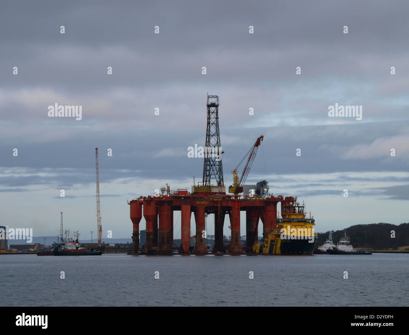 The Semi-Sub Oil Rig 'Borgston Dolphin' being maneuvered from the dry dock at the Nigg Energy Park after a four month refit. Stock Photo
