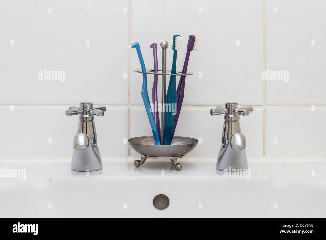 Toothbrushes in bathroom [wop] Stock Photo