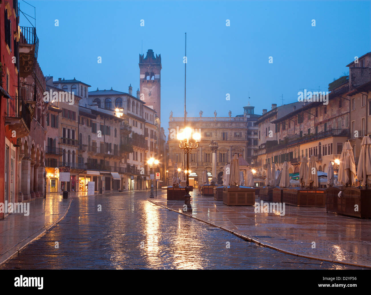 Verona - Piazza Erbe in rainly dusk and Porta Leona and Palazzo Maffei in backgroud Stock Photo