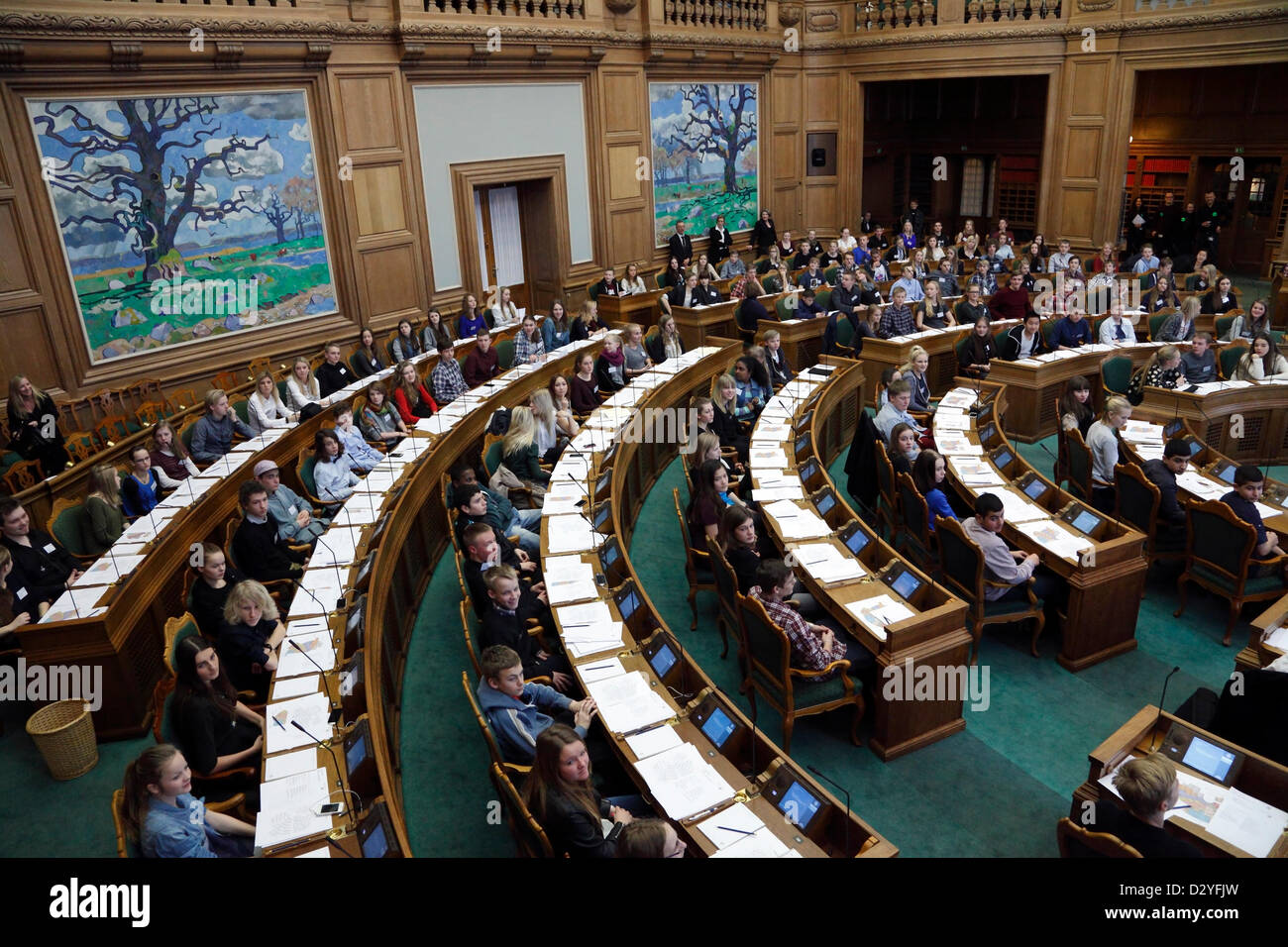 The seats of Folketinget, the Danish Parliament, are today taken by the Youth Parliament members of selected form 8 and 9 students from all over Denmark. The Danish Youth Parliament is held every second year by the Danish Parliament.  The 179 seats are taken by Danish secondary students, grades 8 and 9, invited to become politicians for one day. The purpose is to introduce the rules on which democracy is based in order to increase understanding of the processes leading to democratic decisions and to understand the interplay between the democratic decision-making processes. Stock Photo