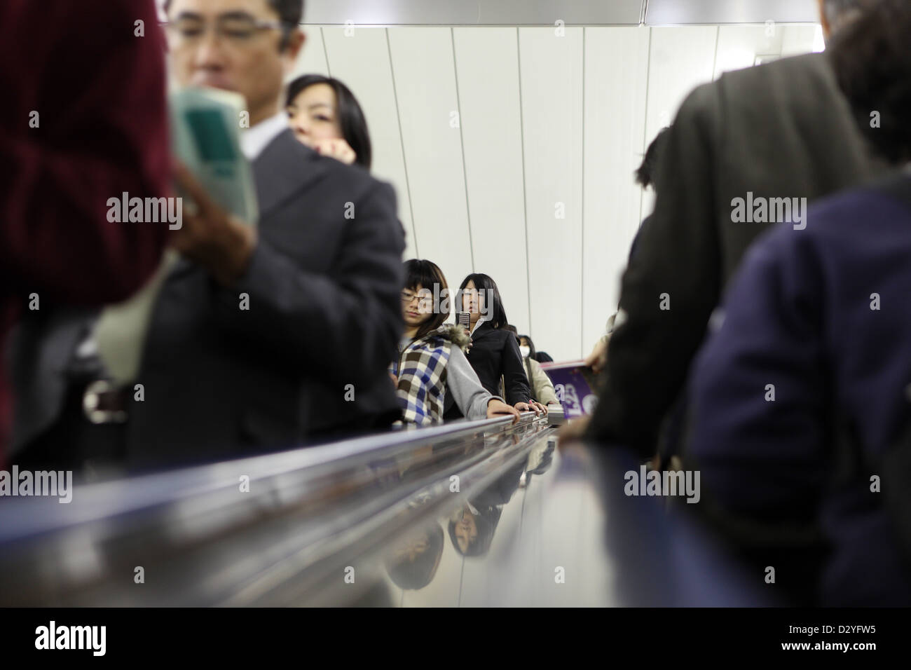 Tokyo, Japan, people on an escalator Stock Photo