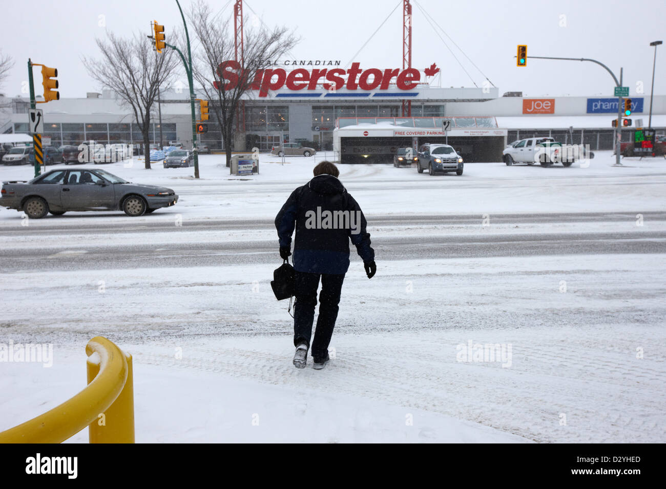 woman crossing the road towards supermarket 8th street Saskatoon