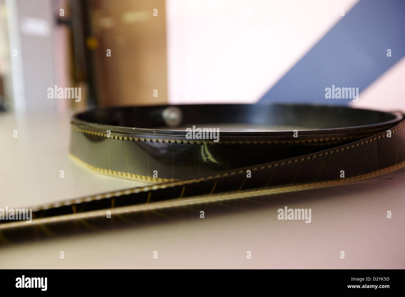 35mm cinema film unwound on spool in old cinema projection room Biggar Saskatchewan Canada Stock Photo