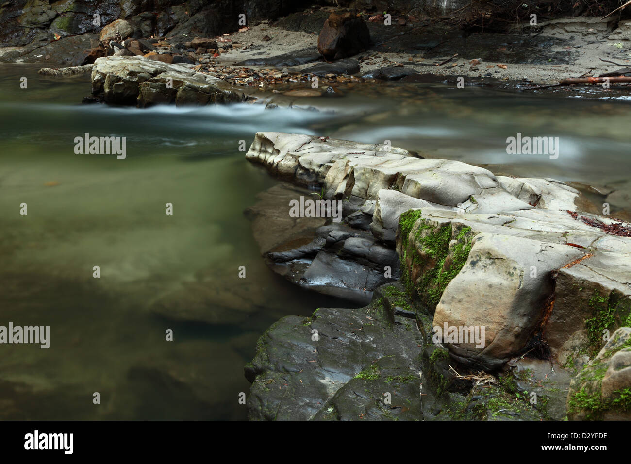 Rocks and flowing stream Stock Photo