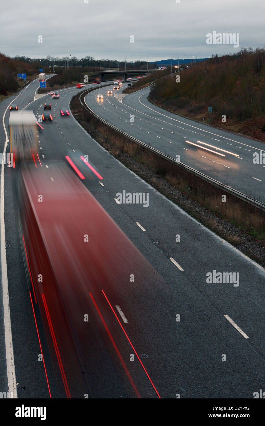 A low light shot of traffic traveling along the M20 motorway in Kent, England Stock Photo