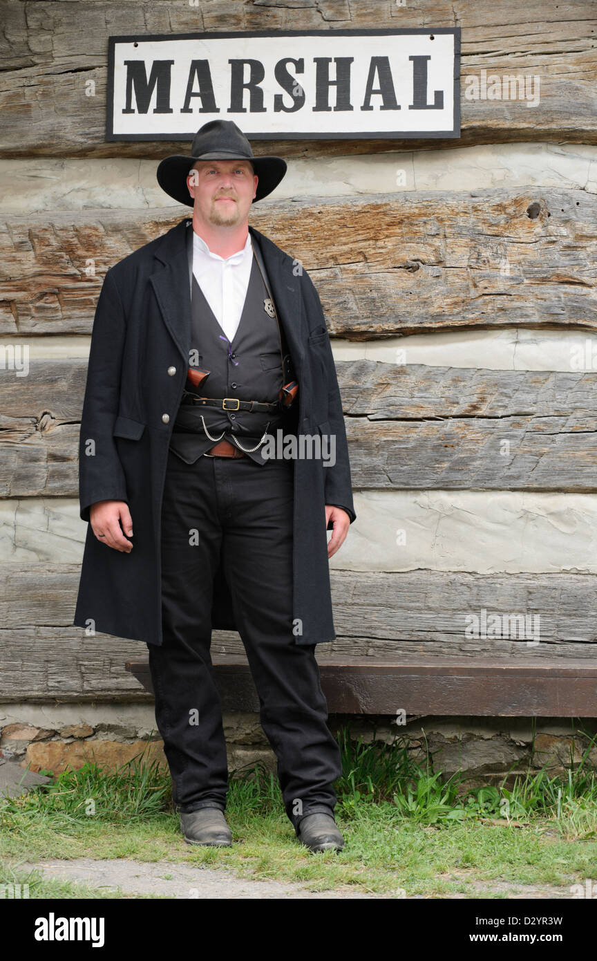 Marshal in the old American west standing watch, authentic reenactor portrayal of sheriff Wyatt Earp. Stock Photo