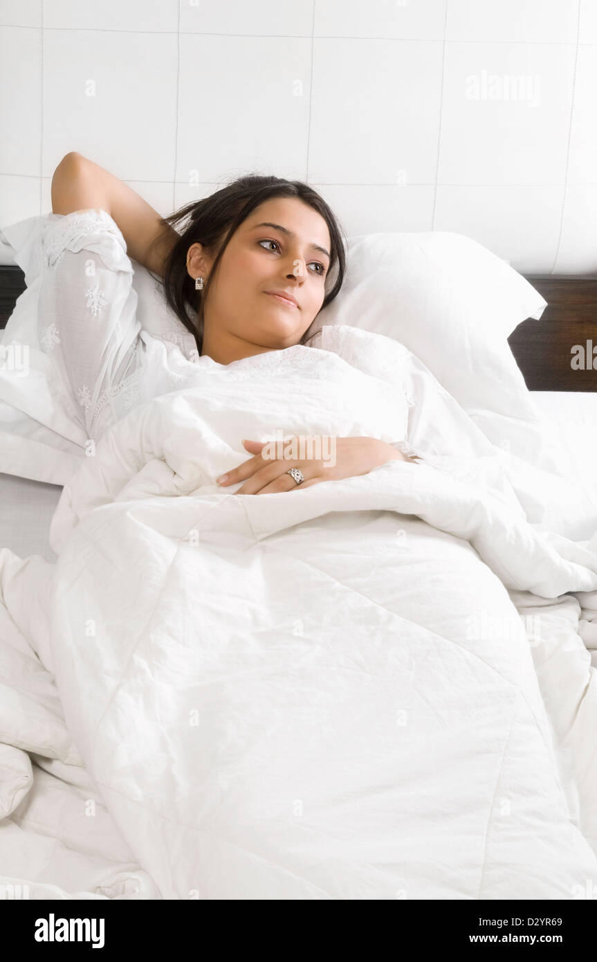 Lady on white bed hi-res stock photography and images - Alamy