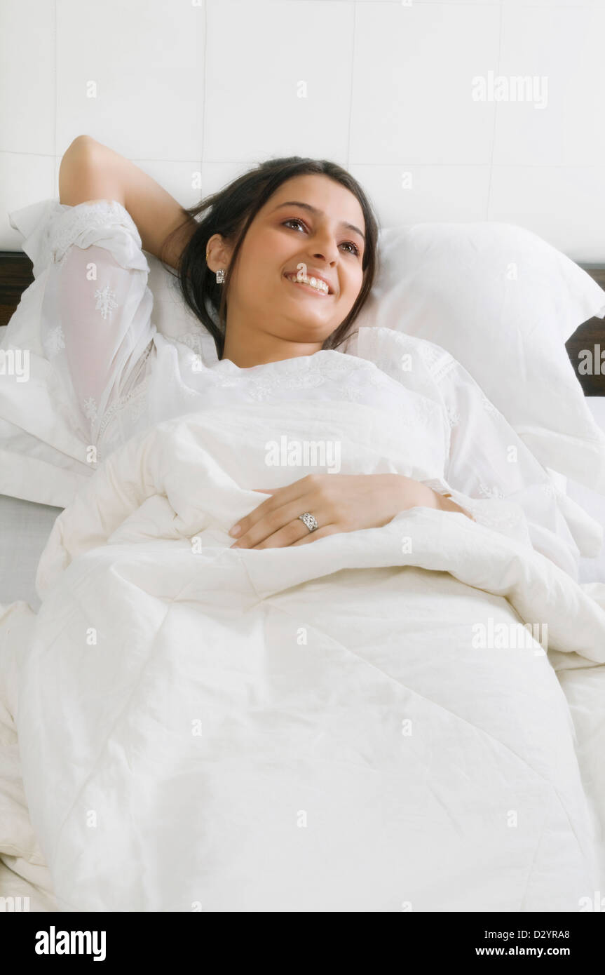 Lady relaxing on bed hi-res stock photography and images - Alamy