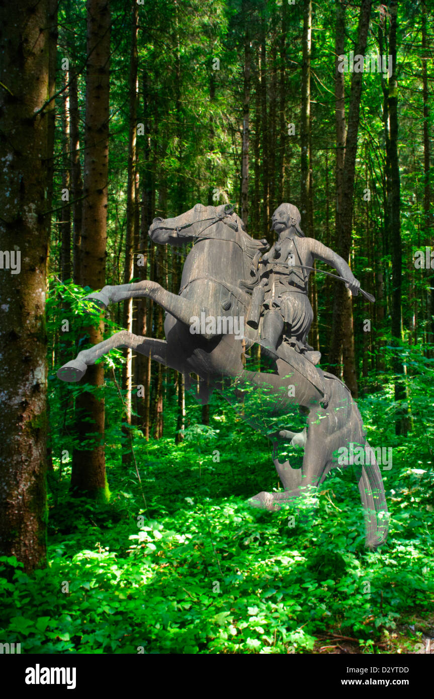 Bronze horseman and horse in a forest. Digitally manipulated image Stock Photo Alamy