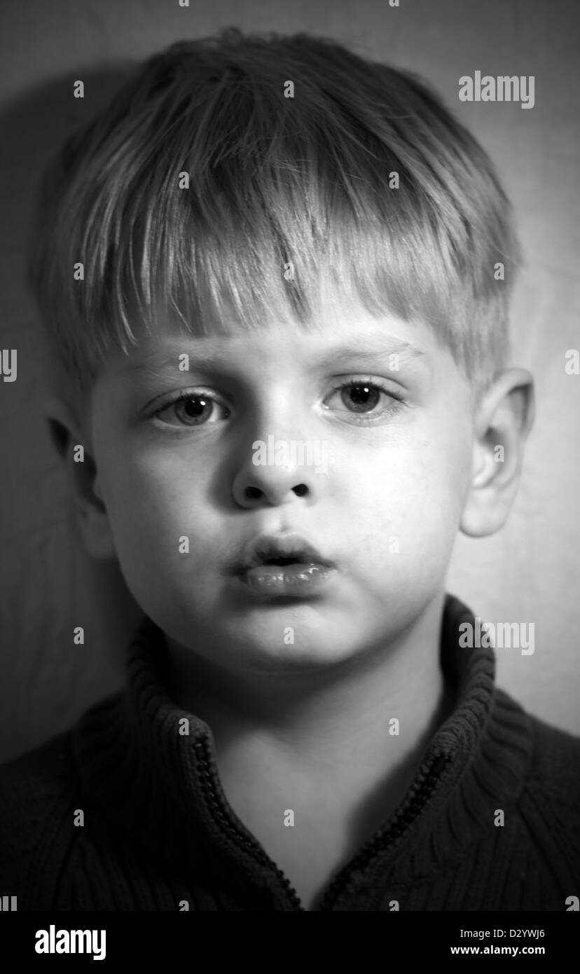 black and white portrait of expressive little boy  Stock Photo
