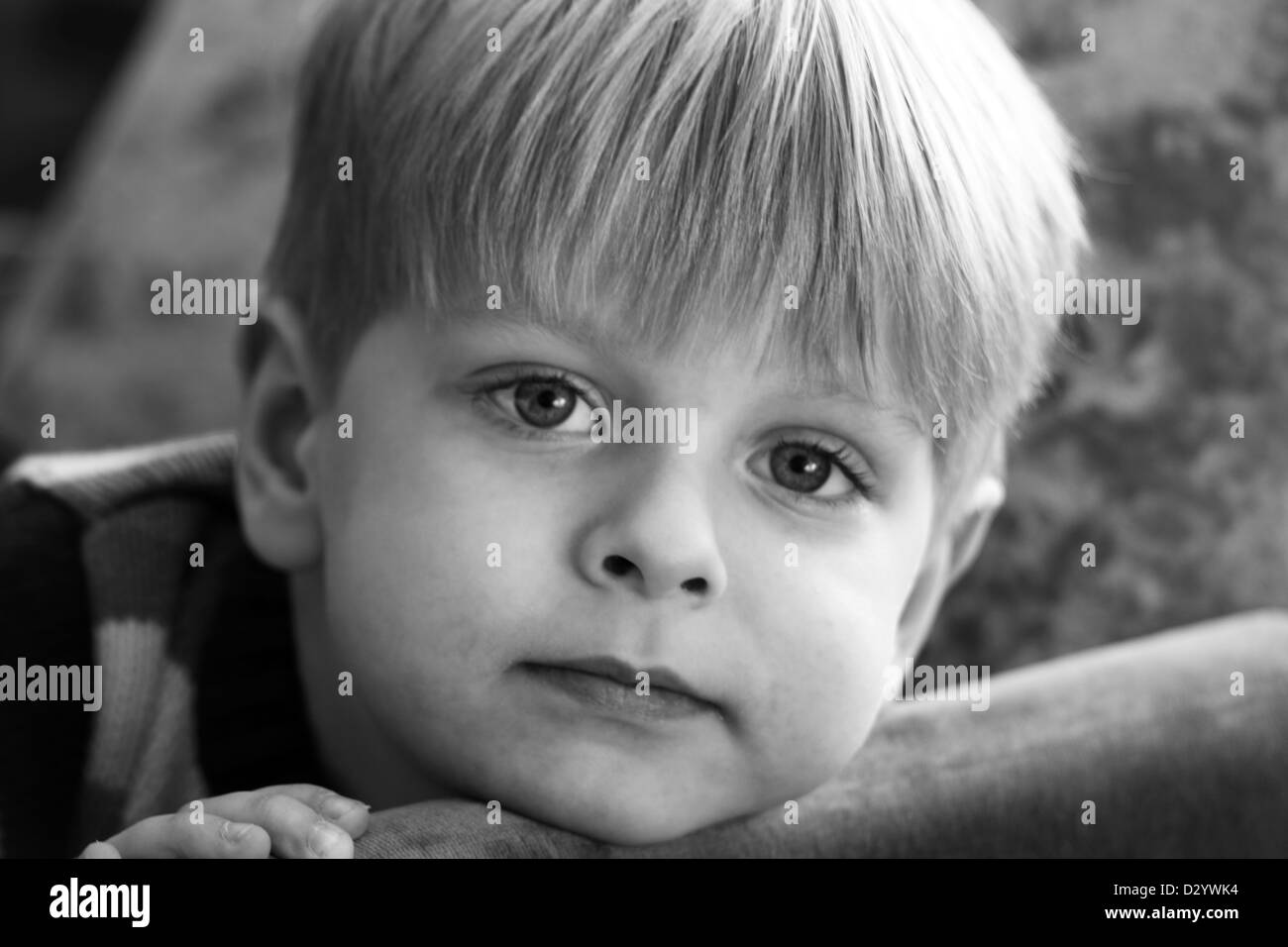 sad boy looking to the camera, black and white Stock Photo