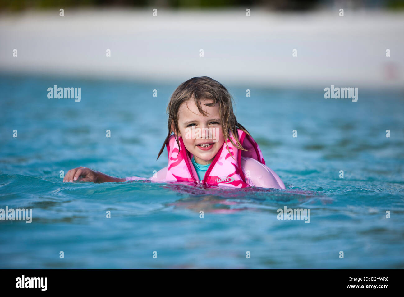 Girl in pink life jacket, Kuda Hura Stock Photo