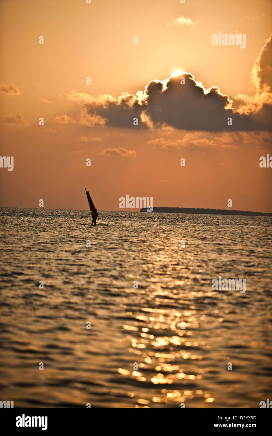 Windsurfing at sunset in the Maldives Stock Photo
