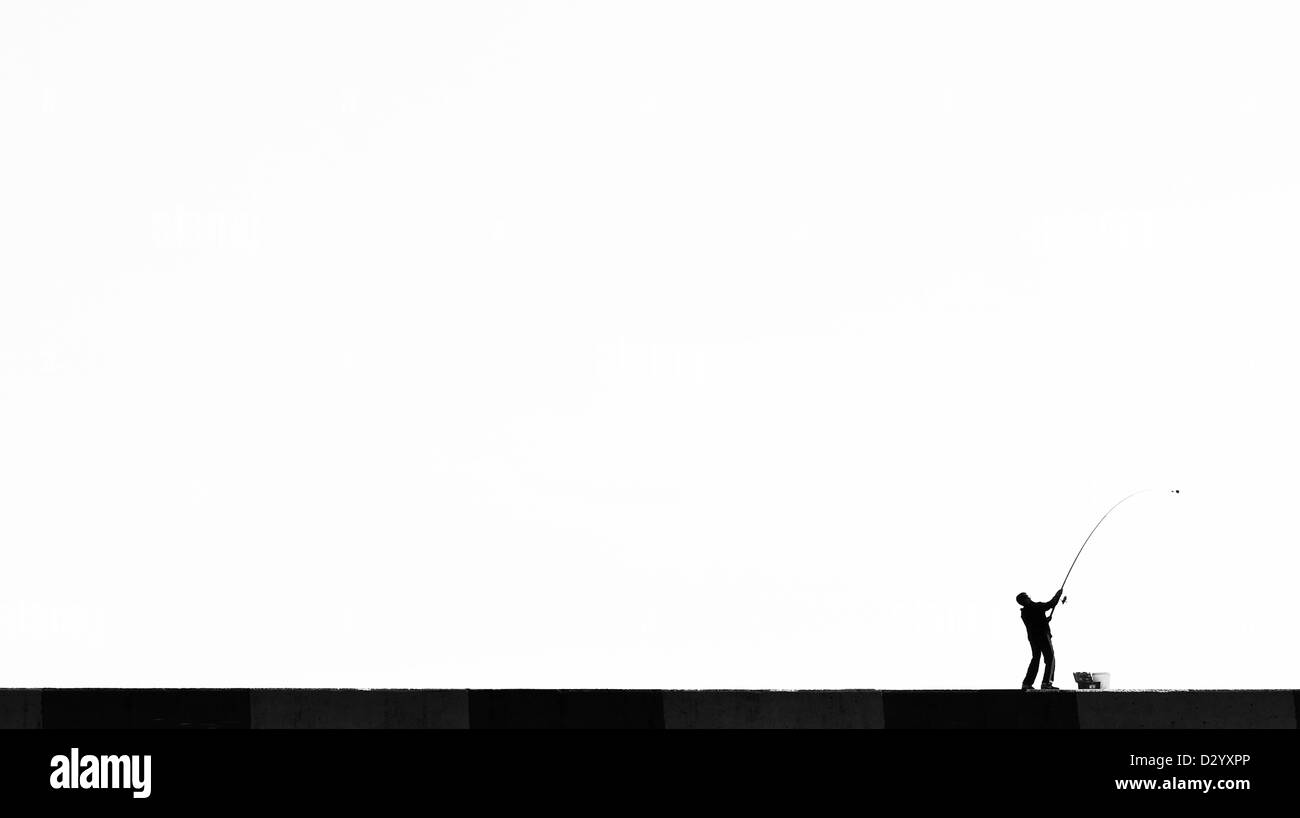 Young Fisherman Silhouette, BW Stock Photo
