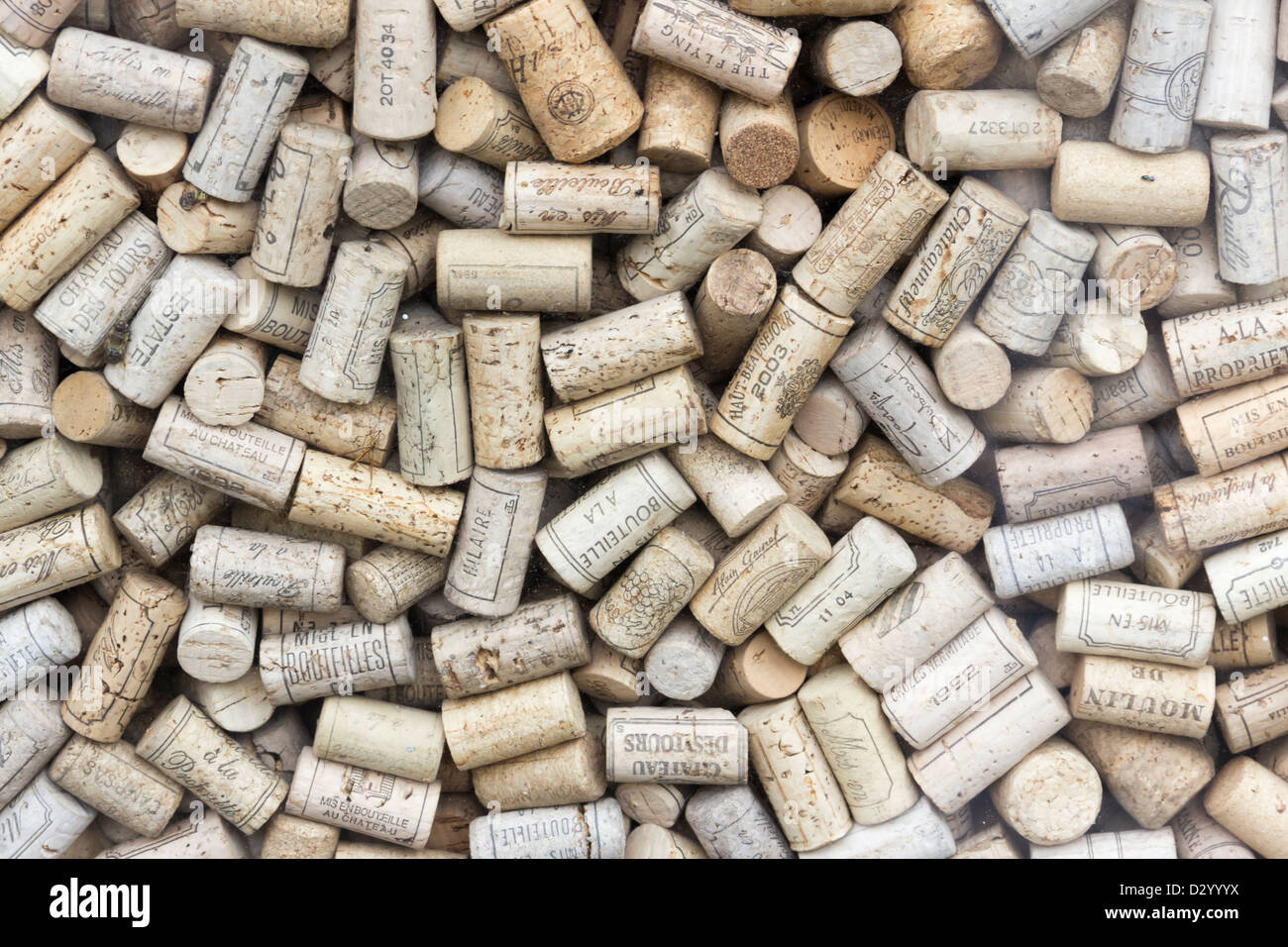 Full frame of wine bottle corks, many printed in French, which form part of a window display of a wine shop in Bath. Stock Photo