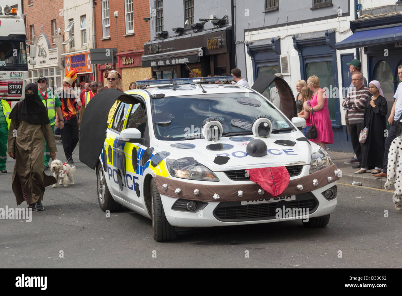 Police car decorated to represent a police dog, taking part in the Gloucester Carnival 2012 procession. Stock Photo