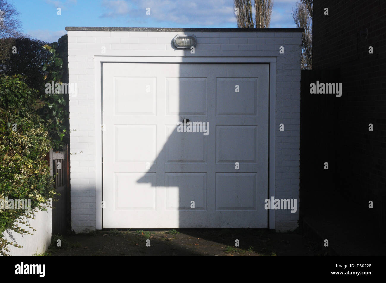 white garage door on detached garage closed Stock Photo