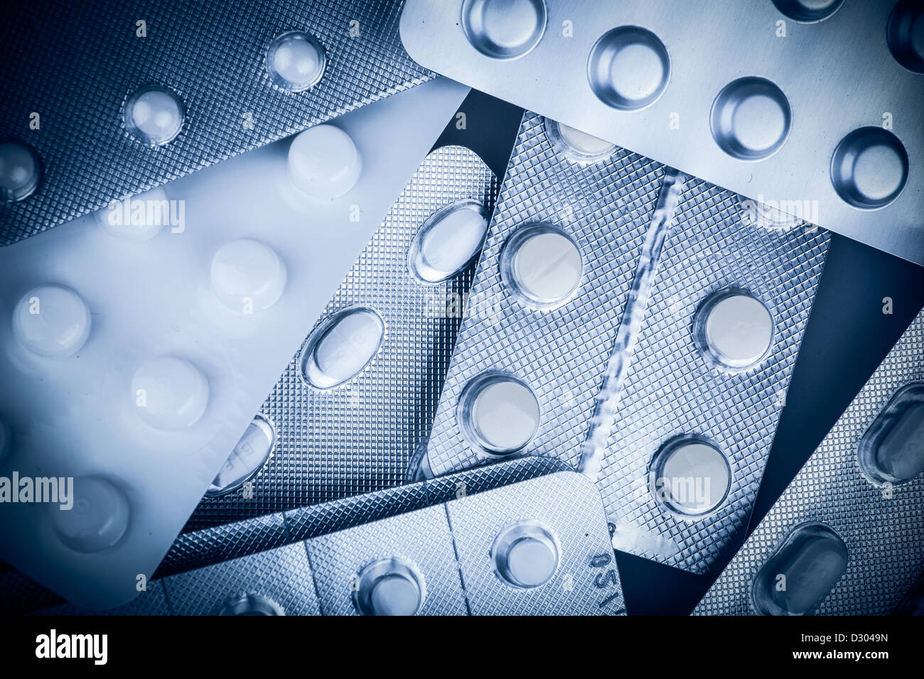 Pills of many shapes and colors grouped together Stock Photo