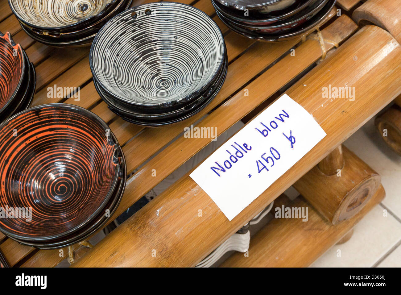 Noodle bowls for sale with sale tag misspelt (noddle blow) Stock Photo