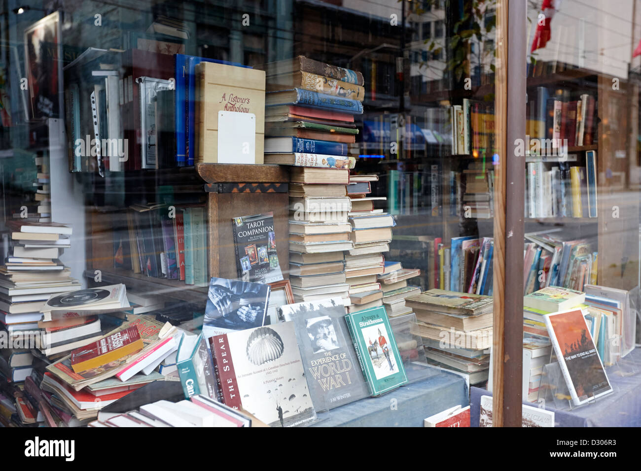 books in the window of a used book store Vancouver BC Canada Stock Photo
