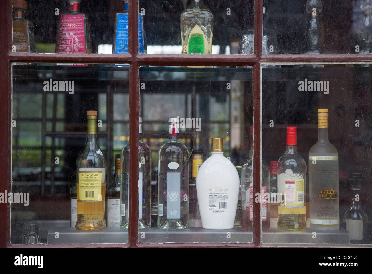 San Diego, California - Bottles in the window of a bar in downtown San Diego. Stock Photo