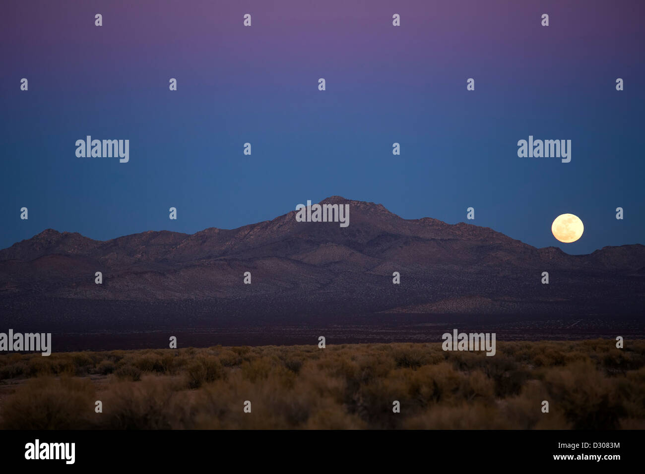 Kramer Junction, California A full moon rises over Fremont Peak in