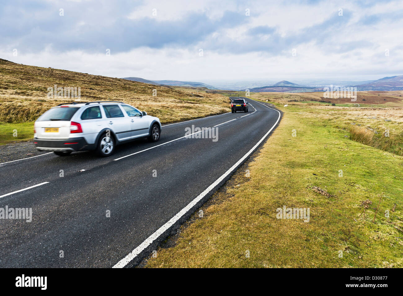 Cars on the road over Llangynidr Moors in Powys, Wales, UK Stock Photo