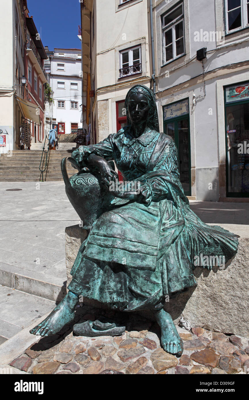 Monument to the singers of the old town, the Tricana of Coimbra, Portugal. The statue is in the Almedina district of Coimbra. Stock Photo