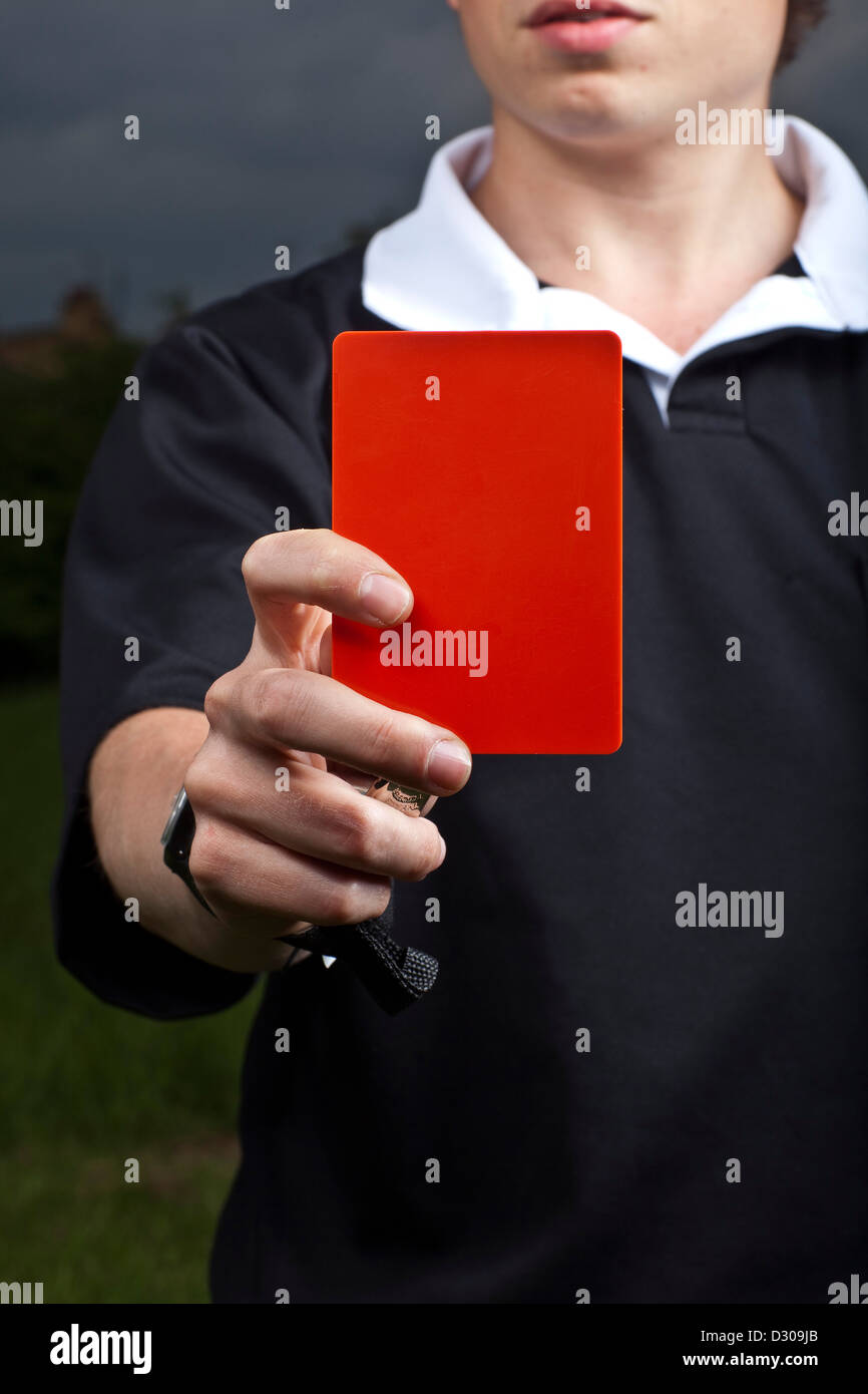 Referee holding red card football Stock Photo Alamy