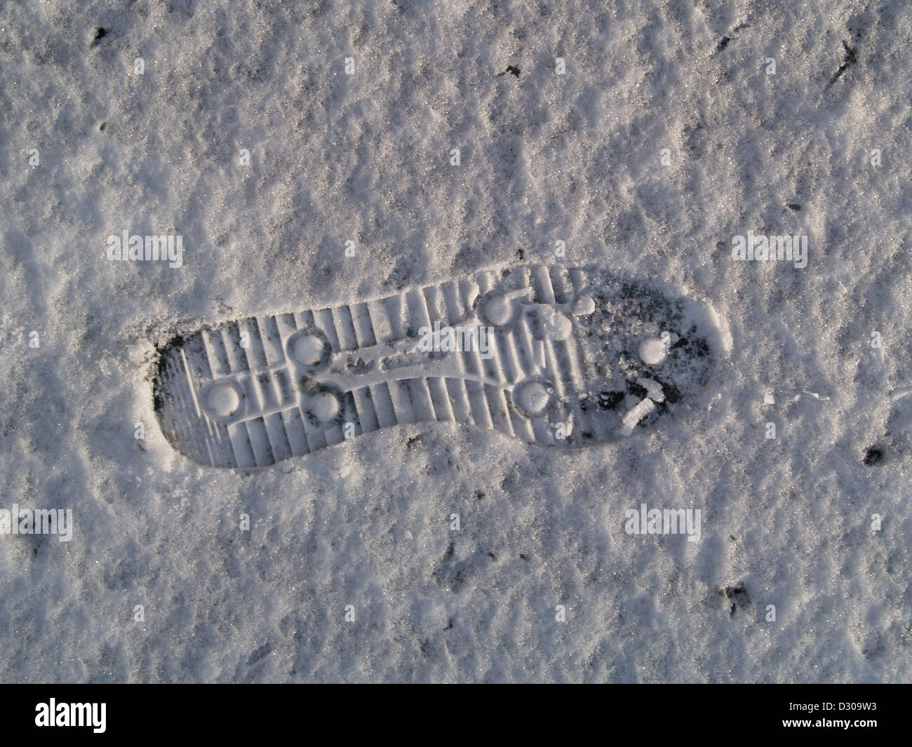 Footprint in the snow, Cromarty, Scotland Stock Photo