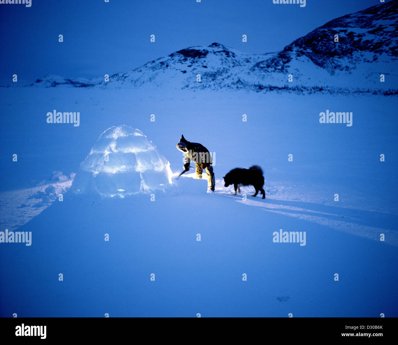 © Sherman Hines Inuit Man at Igloo with Dog Nain, Labrador and Newfoundland Canada  Stock Photo