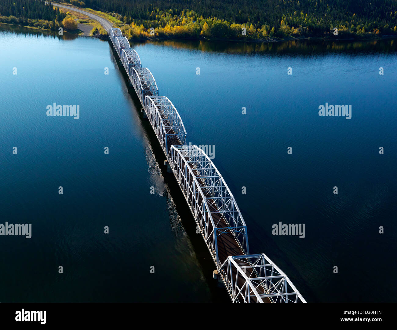 The long Teslin Bridge and the Alaska Highway crossing Nisutlin Bay in the Yukon Territory in Canada. An aerial stock photo. Stock Photo