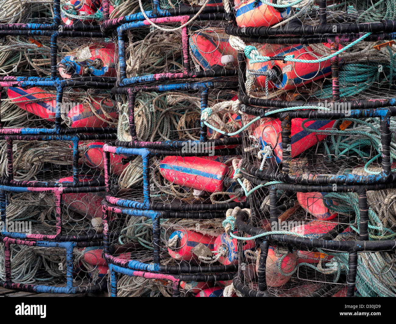 Colorful floats in crab pots stacked at Newport Haebor. Oregon Stock Photo