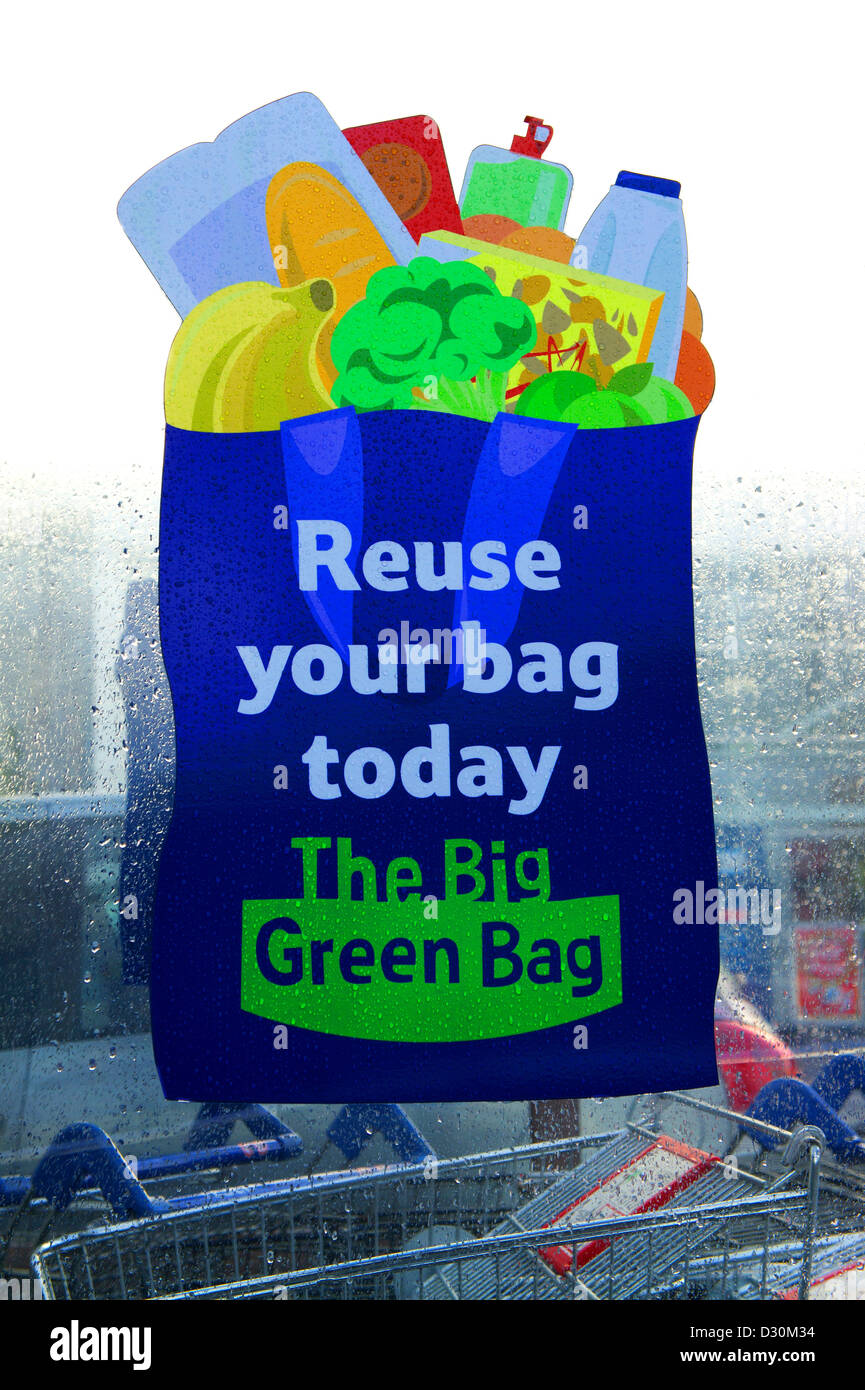 a reuse your big green bag sign outside a tesco supermarket Stock Photo