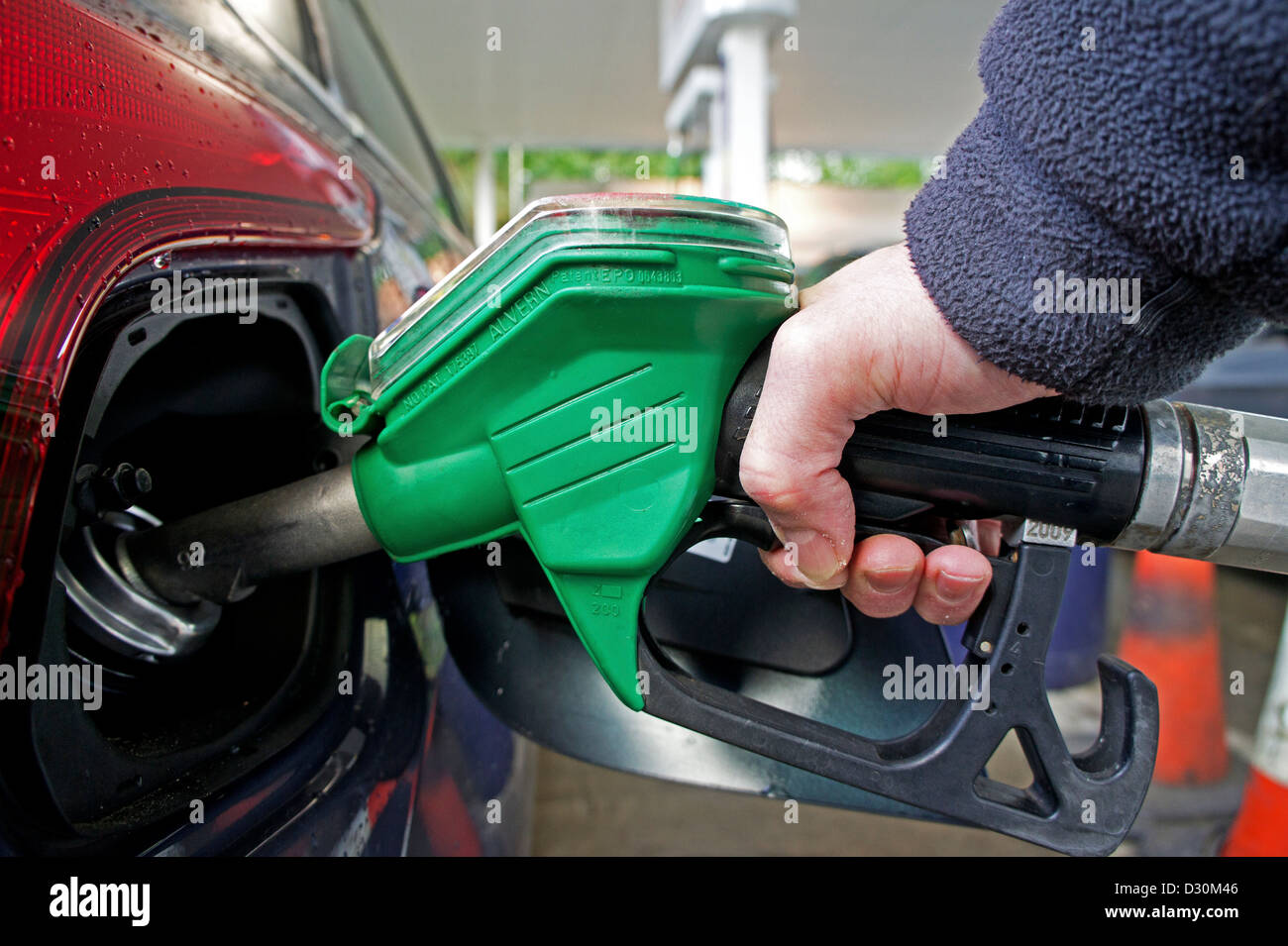 a customer filling a car with unleaded petrol Stock Photo