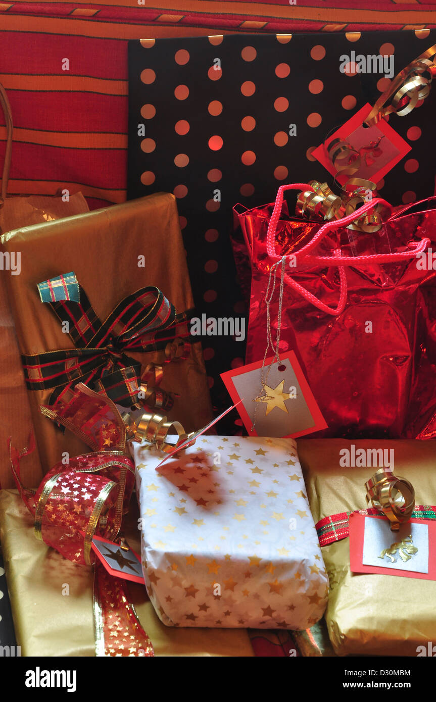 A collection of wrapped presents with bows and ribbons Stock Photo