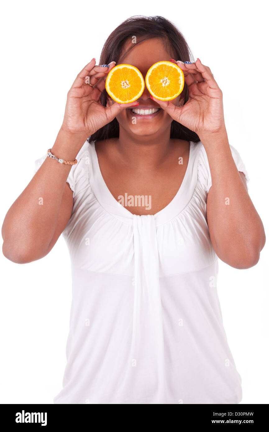 Young happy indian woman holding orange slices, isolated on white background Stock Photo