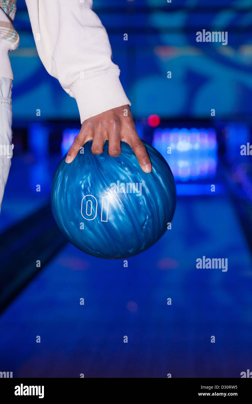 African American hand holding a bowling ball Stock Photo