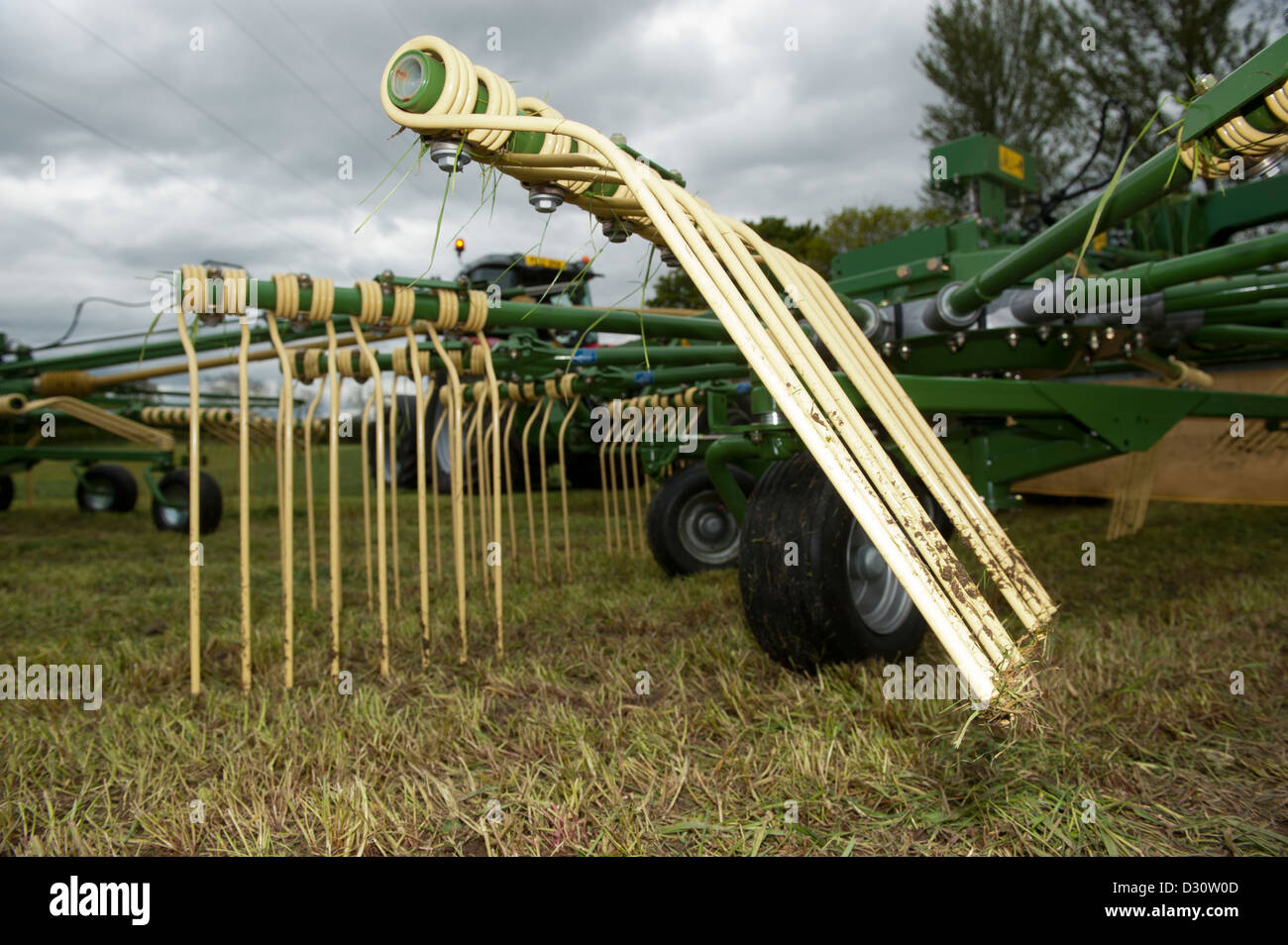 Close up of the tines on a Krone Sward 1400 rowing up machine in silage field. Stock Photo