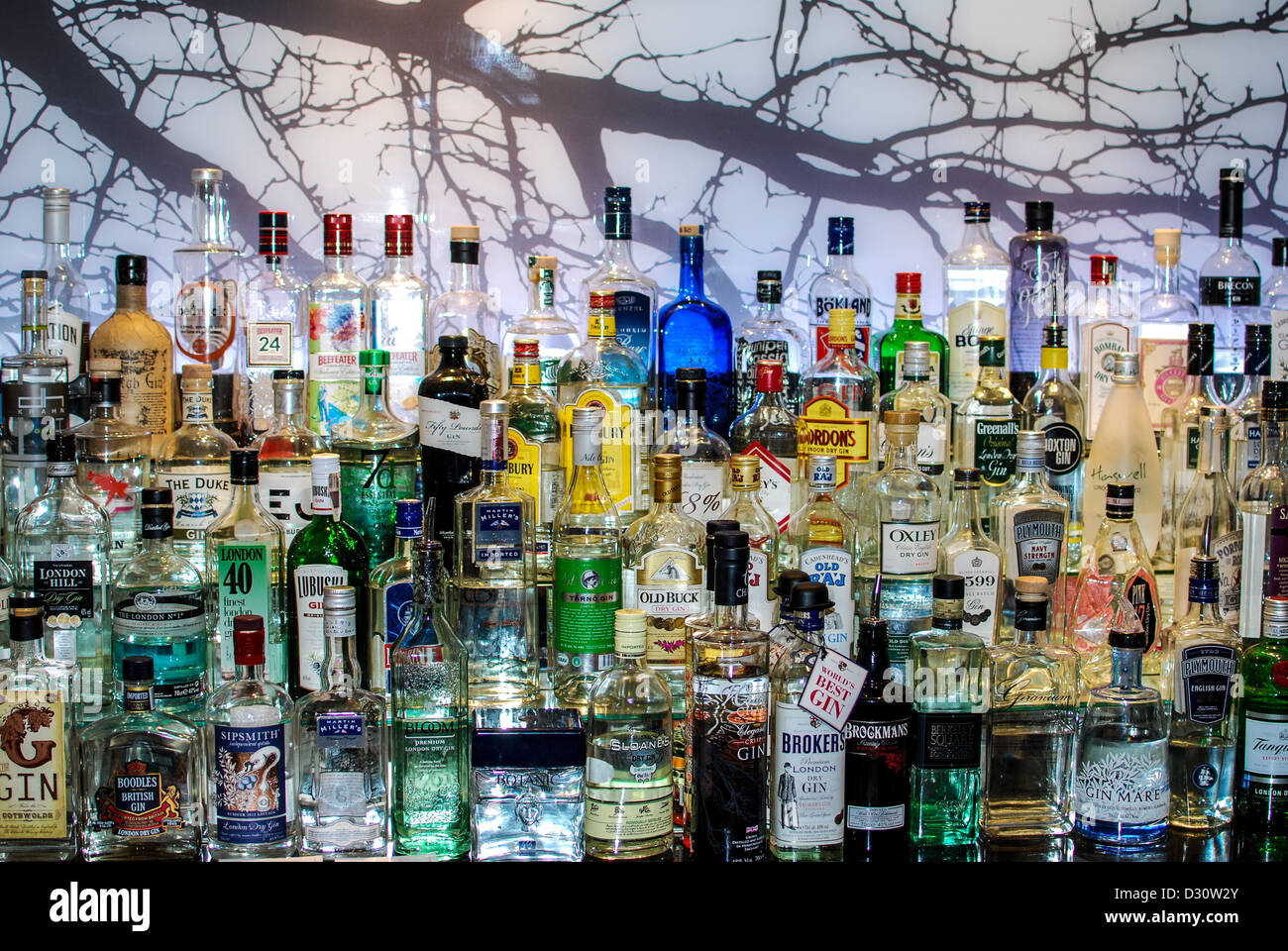 A large collection of gin in bottles Stock Photo