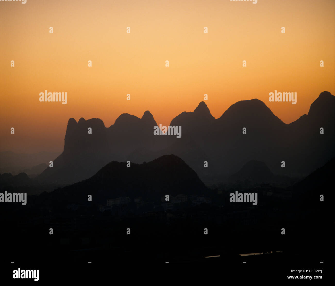 Peoples Republic of China, Guangxi, limestone pinnacles of Guilin at dusk Stock Photo