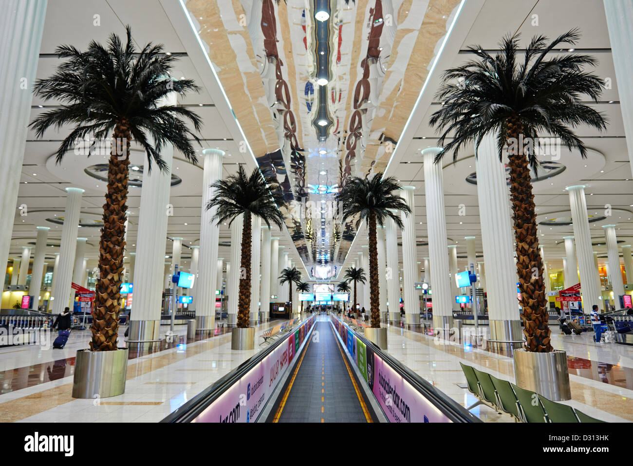 Palm trees line the walkway at the arrival and departure terminal of