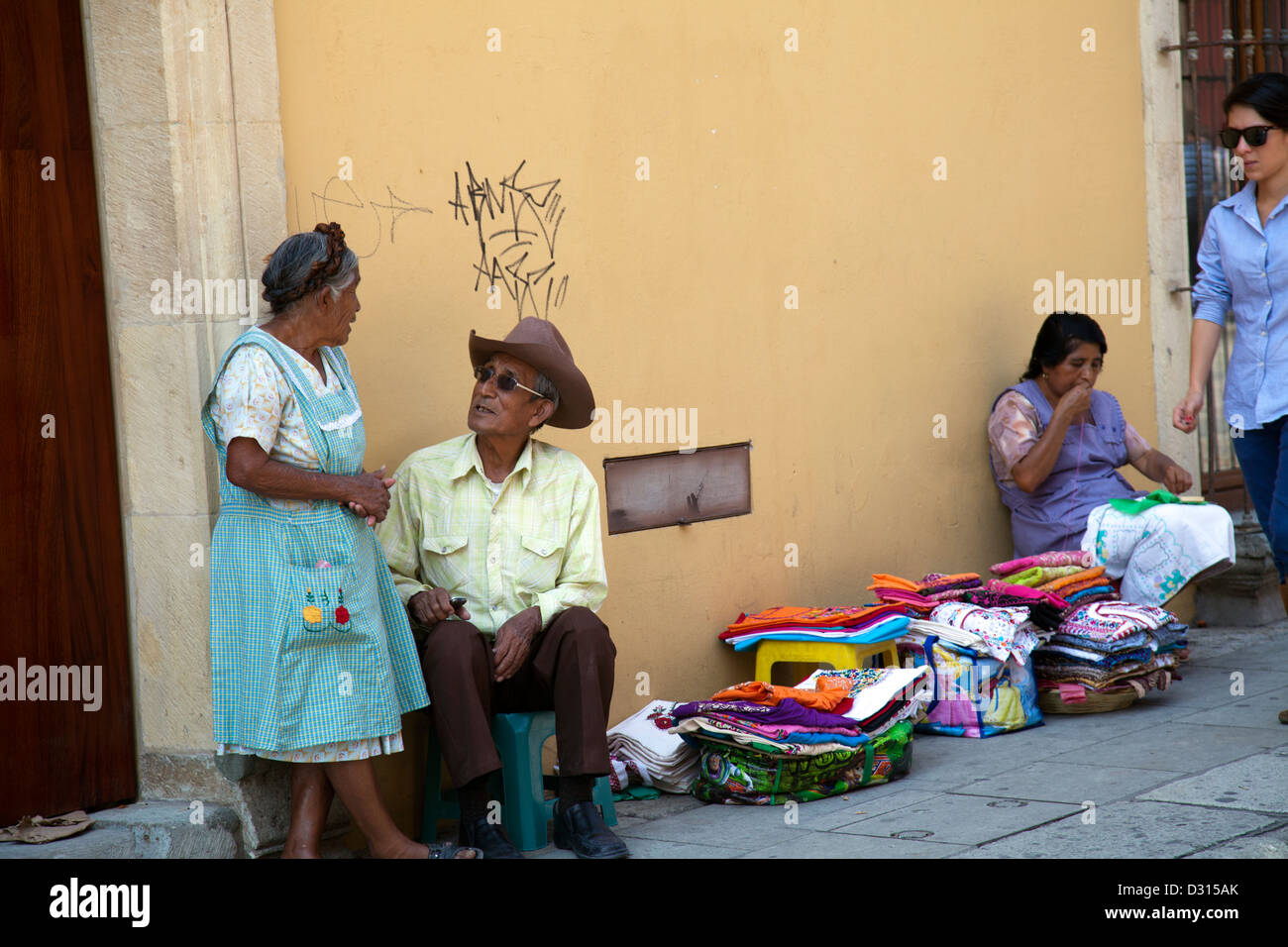 Vendors selling Textiles and Clothing on Oaxaca Sidewalk Mexico Stock