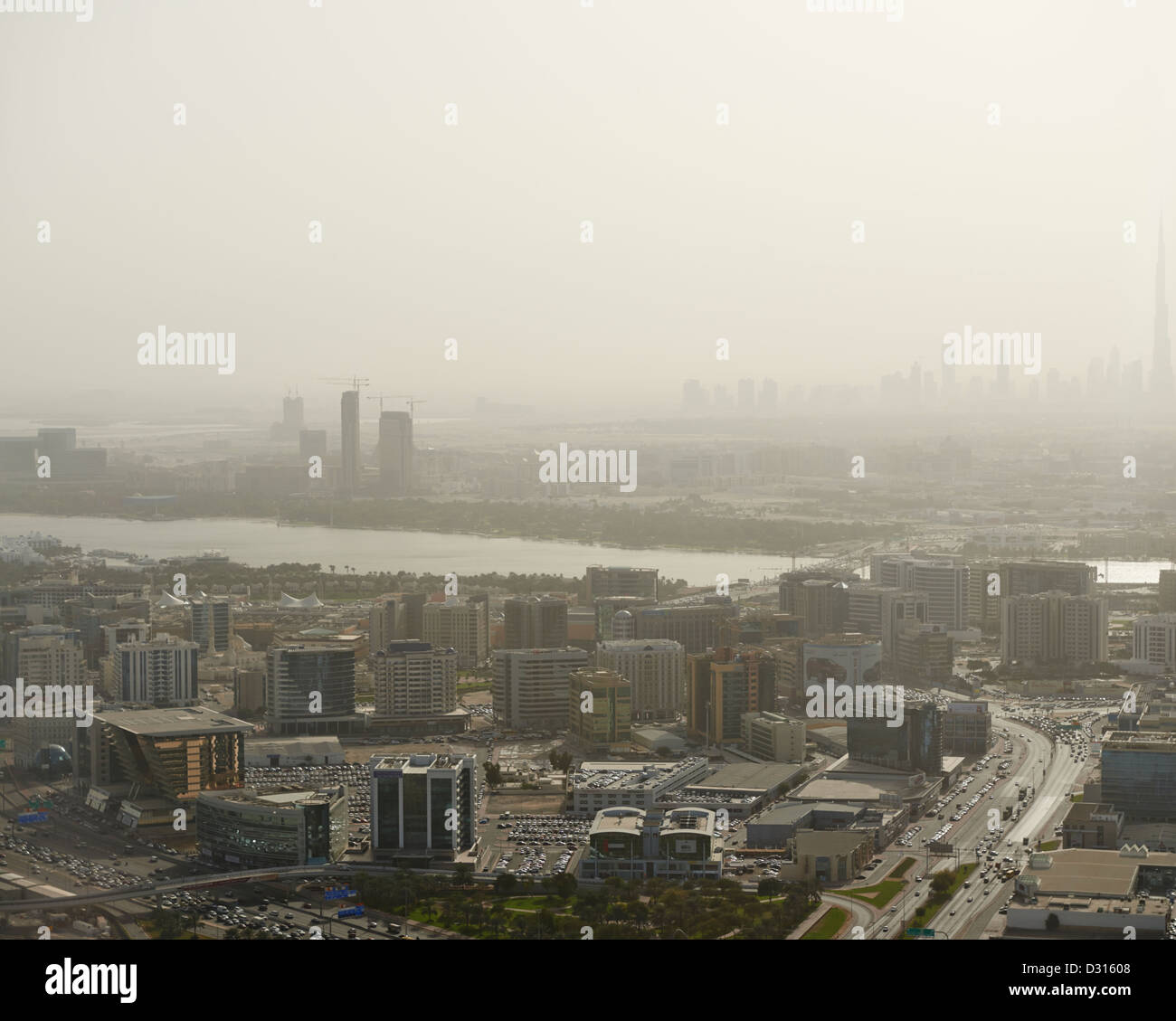 The pollution filled skyline of Dubai, with the towering Burj Khalifa Tower in the distant horizon Stock Photo